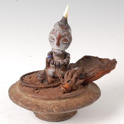 Lot 90 - * A small Power fetish figure, having a tooth...