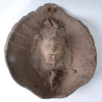 Lot 92 - * A house fetish, the central mask with...