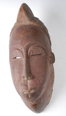 Lot 60 - * A large helmet form initiation mask, Baule...