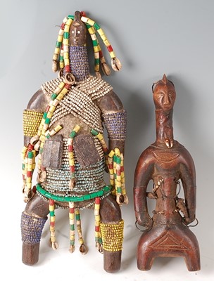 Lot 77 - * A fetish type fertility figure, mounted with...