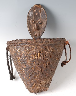 Lot 79 - * A woven rattan reliquary basket, complete...