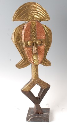 Lot 94 - * A large reliquary guardian figure, the brass...