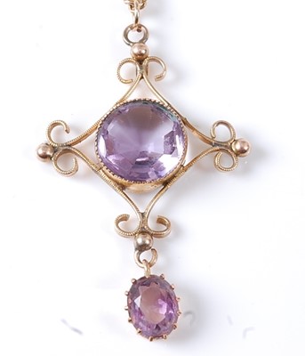 Lot 2811 - An Edwardian 9ct gold amethyst set pendant on...