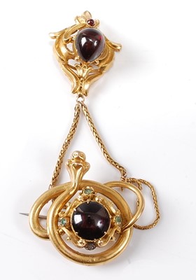Lot 2815 - A yellow metal cabochon garnet set snake...