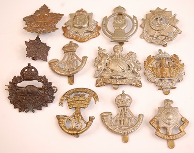 Lot 2220 - A collection of cap badges and insignia to...