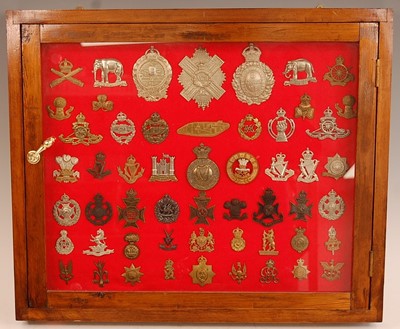 Lot 2221 - A collection of cap badges and insignia to...