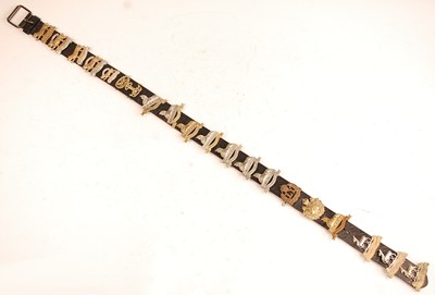 Lot 2203 - A collection of cap badges and insignia to...