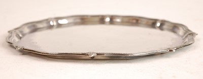 Lot 3065 - A George V silver salver, having a beaded...