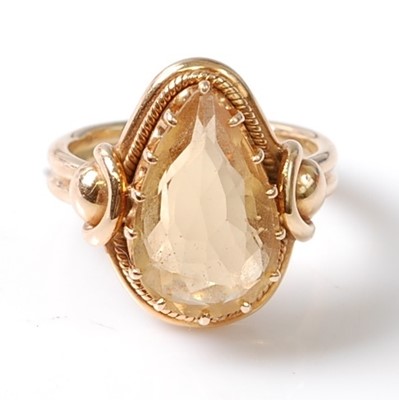 Lot 3130 - A yellow metal citrine dress ring, featuring a...