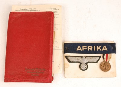 Lot 2384 - A red leather wallet marked to the front...