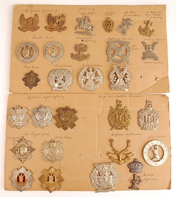 Lot 2207 - A collection of cap and glengarry badges to...