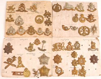 Lot 2215 - A collection of cap badges and insignia to...
