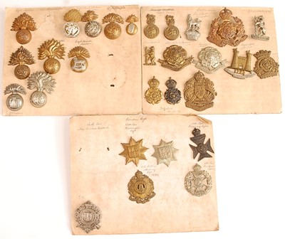 Lot 2216 - A collection of cap badges and insignia to...
