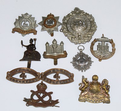 Lot 2224 - A collection of cap badges and insignia to...