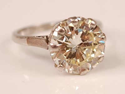 Lot 3100 - A platinum diamond solitaire ring, featuring a...