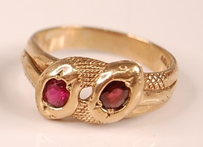 Lot 3116 - A 9ct yellow gold double-headed intertwining...