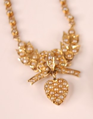 Lot 3111 - A yellow metal sweetheart necklet, comprising...