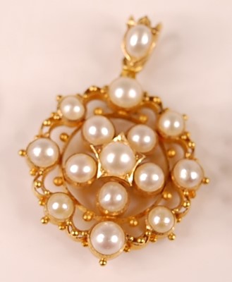 Lot 3112 - A yellow metal openwork oval cluster pendant,...