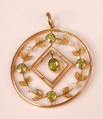 Lot 3127 - A yellow metal, peridot and seed pearl...