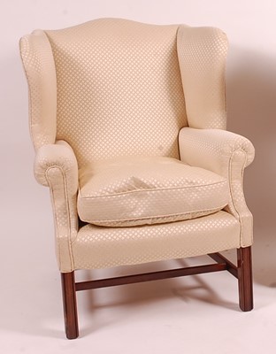 Lot 3353 - A mahogany framed wingback armchair, in the...