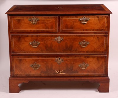 Lot 3410 - A figured walnut and crossbanded chest, in the...