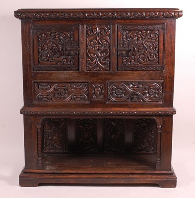 Lot 3398 - An antique joined and heavily floral relief...