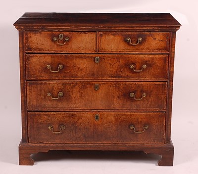 Lot 3396 - A George II oak and walnut fronted chest, of...