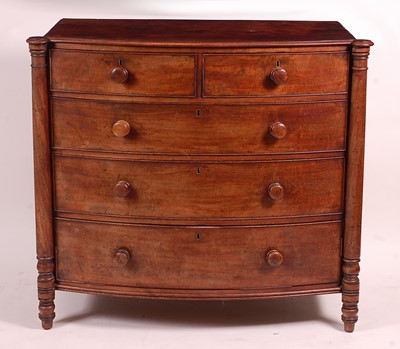 Lot 3401 - A George IV mahogany bowfront chest, of two...