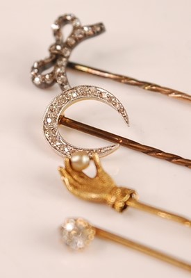 Lot 3121 - A yellow metal and diamond set stick pin, the...