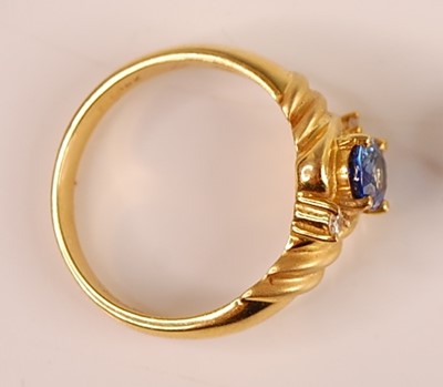Lot 3092 - An 18ct gold Ceylon sapphire and diamond set...