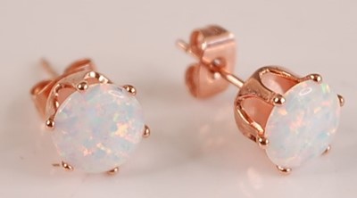 Lot 413 - A pair of gilt metal and faux opal set ear studs