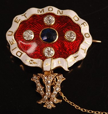 Lot 1088 - A yellow metal, sapphire and diamond enamel...