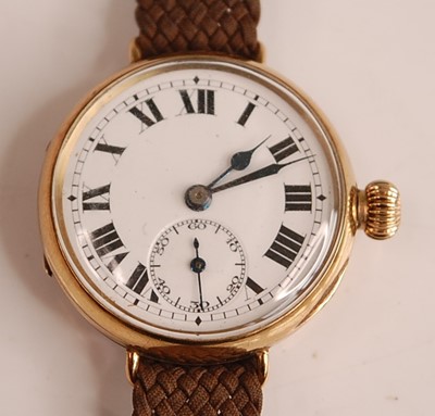 Lot 1167 - A 9ct yellow gold manual wind trench watch,...