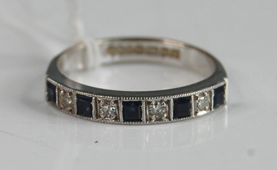 Lot 351 - An 18ct white gold, sapphire and diamond half...