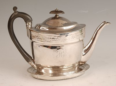 Lot 1037 - A George III silver teapot and stand, the...