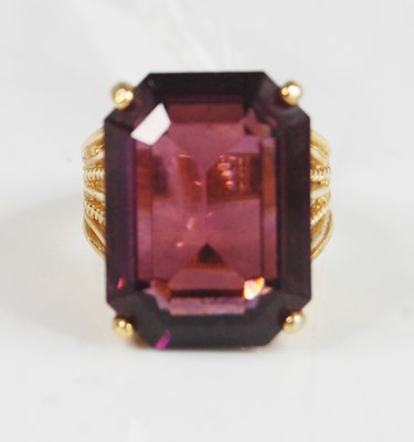 Lot 361 - A yellow and metal dress ring with a large...