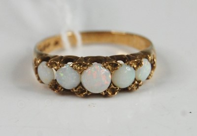 Lot 363 - A 9ct yellow gold opal five stone half hoop...