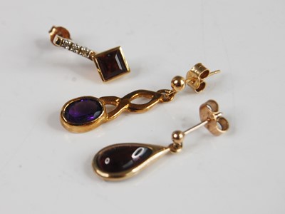 Lot 364 - Three odd yellow metal earrings - A 9ct yellow...