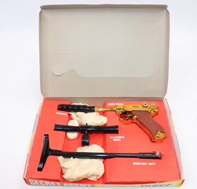 Lot 1938 - A boxed Cresent Luger pistol with a silencer,...