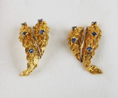 Lot 373 - A pair of yellow metal heavily gilded stylized...
