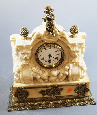 Lot 153 - An early 20th century carved alabaster mantel...