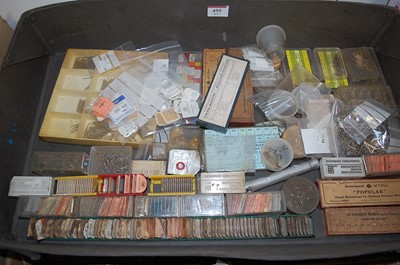 Lot 495 - Two boxes of assorted watchmakers components,...