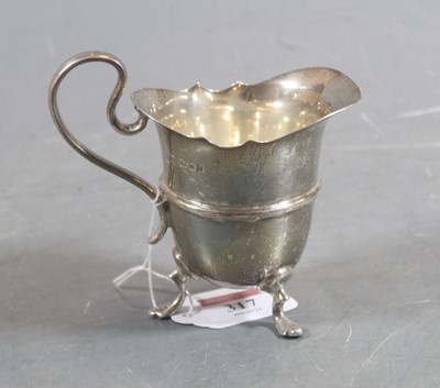 Lot 317 - A George V silver helmet shaped cream jug,...
