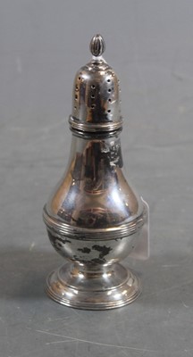 Lot 319 - A George V silver pedestal pepperette, having...