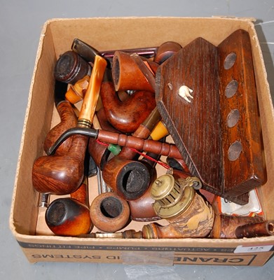Lot 425 - An early 20th century oak pipe rack for four...