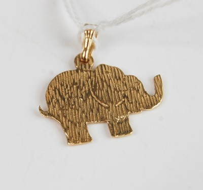 Lot 381 - A yellow metal elephant pendant, stamped 14k,...