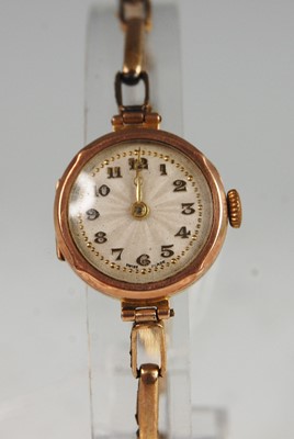 Lot 411 - A lady's 9ct gold cased manual wind wristwatch...