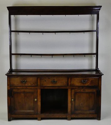 Lot 1345 - A George III joined oak dresser, the...