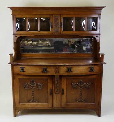Lot 380 - A circa 1900 Art Nouveau oak mirrorback...