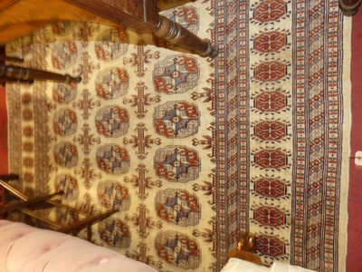 Lot 1366 - A Persian woollen cream ground Bokhara...